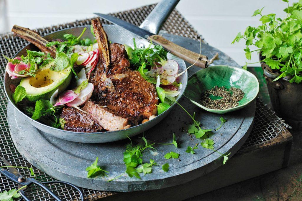 Rib-eye with tomato pesto butter and herb salad recipe